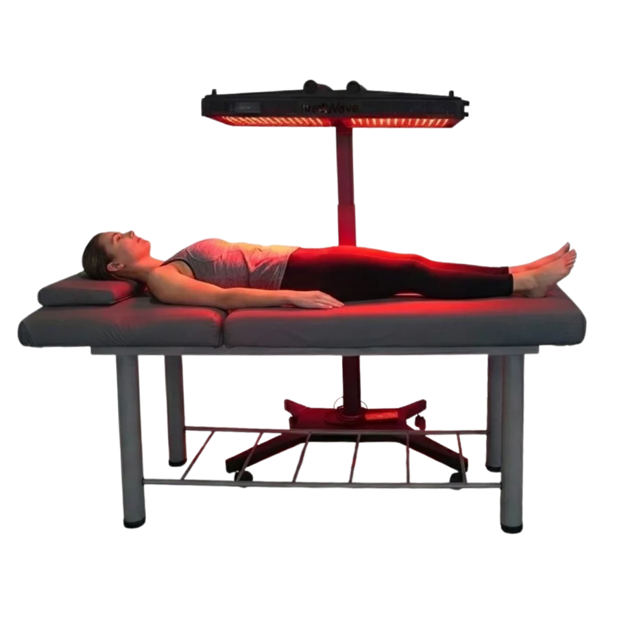 A client lying beneath the MedWave Neuro-100S panel during a session